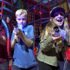 Boy and girl with laser guns at Laser Tag Party at Kidabulous, Sunbury
